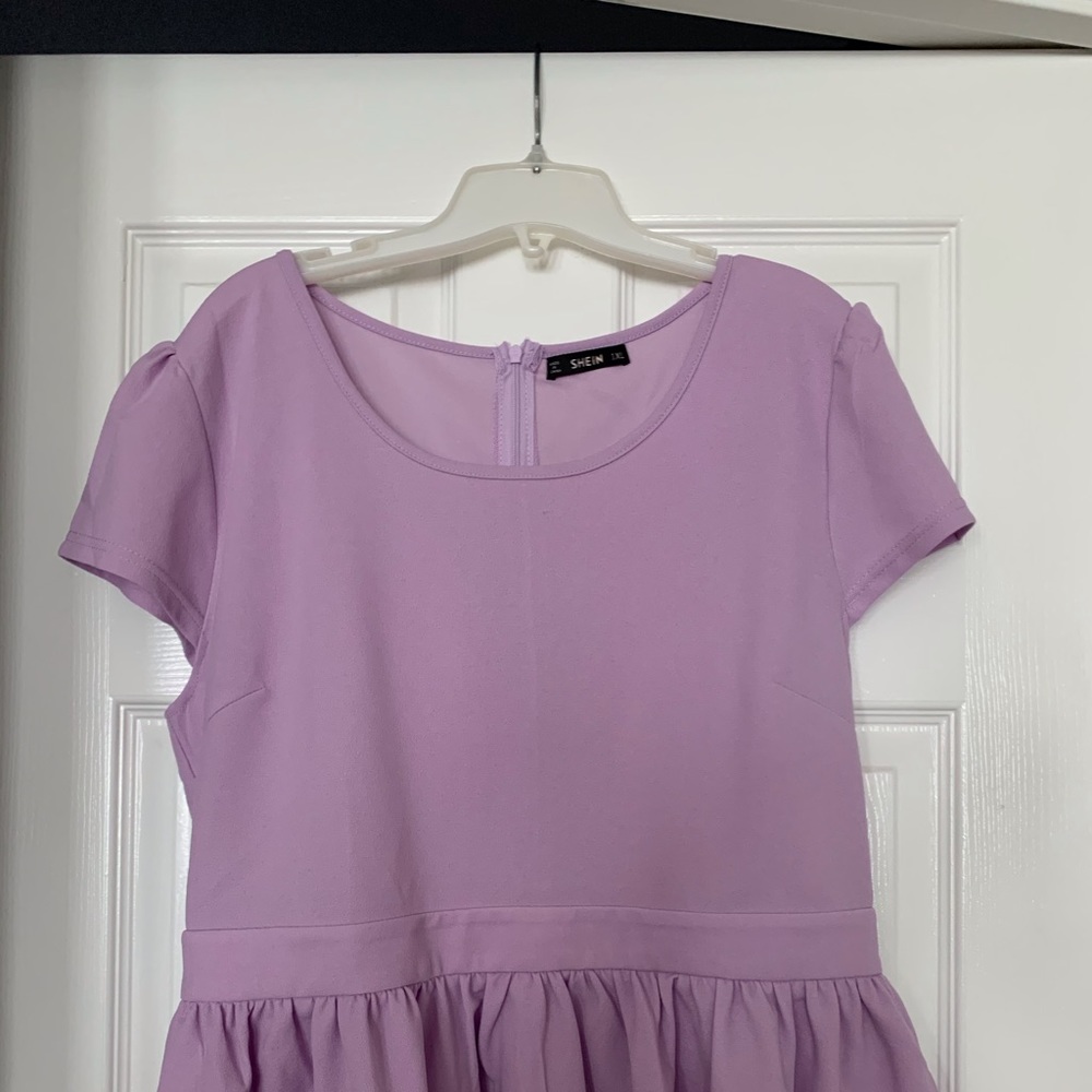 Lilac shirt with ruffle bottom